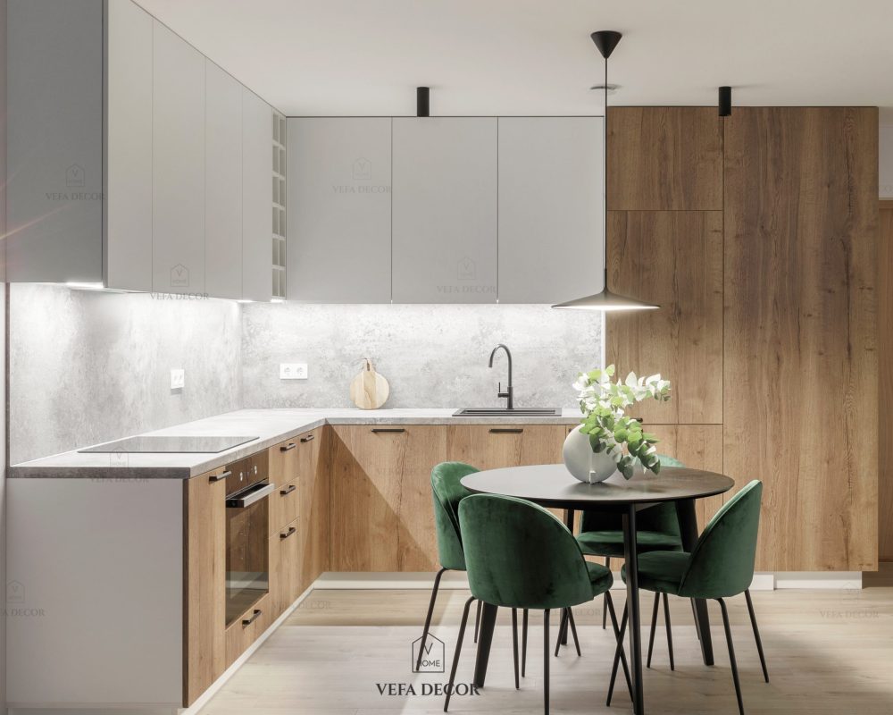 Modern minimalistic kitchen and dining room interior with wooden and white surfaces, green chairs and eucalyptus in ceramic vase. Aesthetic simple interior design concept.
