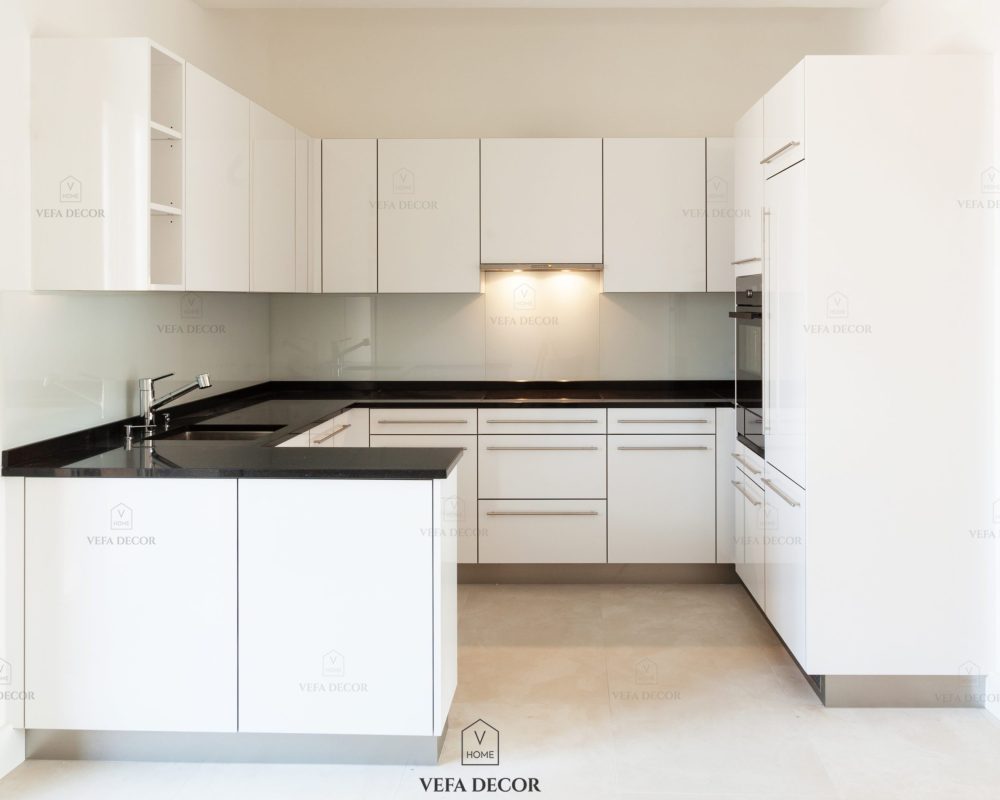 Wide white kitchen in a modern apartment