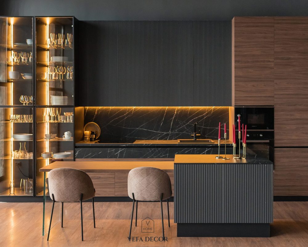contemporary kitchen in a modern style, wooden floor, dark grey interior.  kitchen island. cabinet with glass doors and lighting for wine glasses. upholstered chairs. countertops with black cabinets